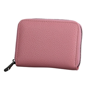 Detailed view of pink lychee leather card holder with secure wrap-around zipper