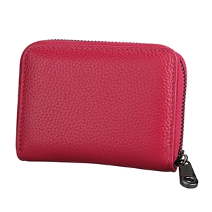 Macro detail of rose red litchi grain leather card holder with gunmetal zipper