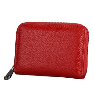 Close-up of a red litchi texture leather RFID card wallet with gunmetal zipper detail