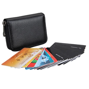 Detail of black lychee leather RFID card holder with a smooth silver metal zipper closer