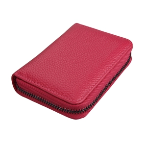 Magenta genuine leather credit card holder with pebble grain texture and zip closure