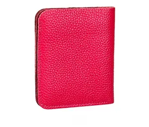 Detail of rose red pebble grain leather wallet showing stitching and texture