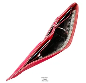 Internal view of peach pink leather wallet showing cash and coin storage capacity