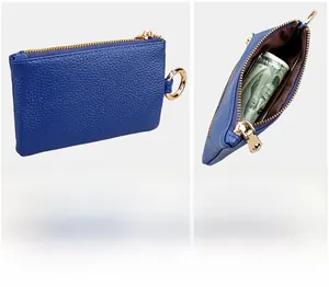 Blue cowhide leather key case detail featuring gold zipper and metal snap hook closure
