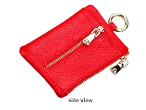Detail view of red lychee grain leather key pouch with golden zipper and metal ring