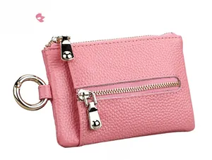 Pink litchi texture leather key pouch with gold zipper and front pocket view