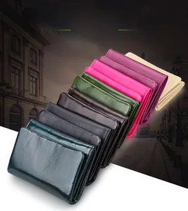 Close-up of trifold RFID leather wallets in various colors like green, pink, and black