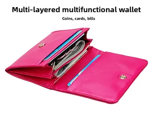 Internal view of a hot pink leather wallet with multiple card slots and coin pocket