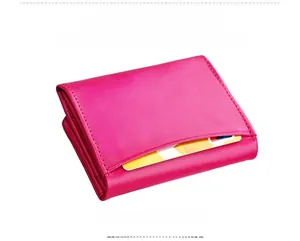 Detail of fuchsia leather wallet with triple-fold structure and external card slot