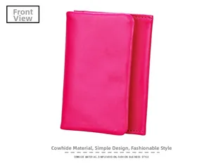 Detailed view of rose red leather card holder with premium grain texture and neat stitching