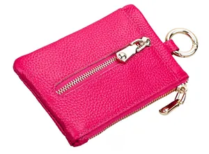 Side view of a fuchsia lychee-grain leather key pouch with silver zipper and carabiner