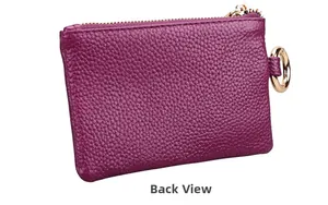 Detailed back view of a purple pebble grain leather coin purse with golden zipper and ring