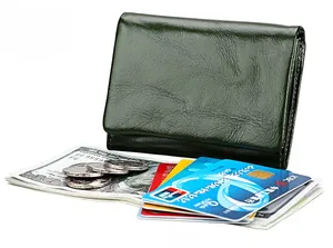 Detailed interior of dark green leather wallet showing slots for cards and cash