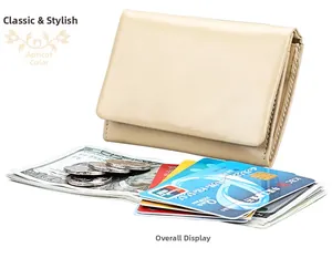 Detail view of apricot leather RFID wallet with cash and cards showing large capacity