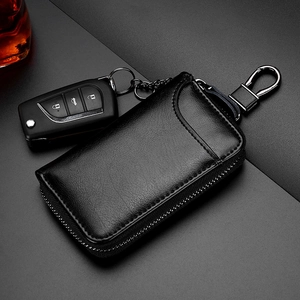 Funda para llave de coche en cuero negro granulado con cremallera y gancho metálico