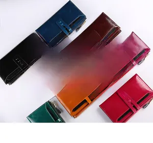 Flat lay of eight multi-color genuine leather long RFID wallets in various vibrant shades