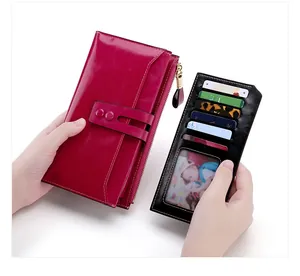 Detail view of pink oil wax leather wallet with detachable black multi-slot card holder