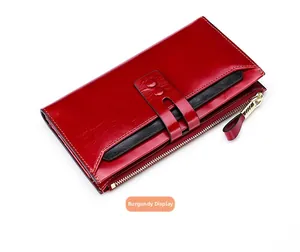 Detailed view of the burgundy leather RFID wallet showing card slots and gold zipper