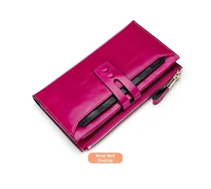 Detail showing rose red leather wallet with double stud closure and card slots