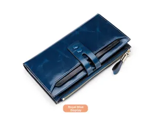 Detail view of royal blue oil wax leather wallet with smooth metal zipper and buckle