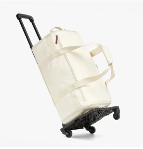Off-white large capacity travel bag set on a black portable folding trolley with wheels