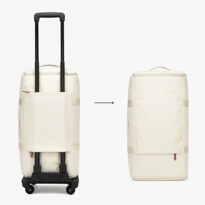 Detail of multi-functional travel bag luggage sleeve showing attachment to a trolley suitcase