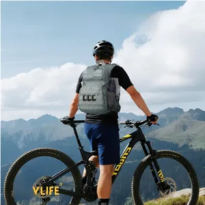 Rear view of light grey tactical hiking hydration backpack with 3L bladder in mountain scenery