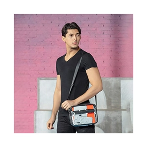 Detailed view of clear PVC crossbody bag showing capacity for phone and notebook