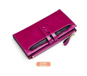 Close-up of a purple RFID leather wallet featuring a gold zipper and buckle closure