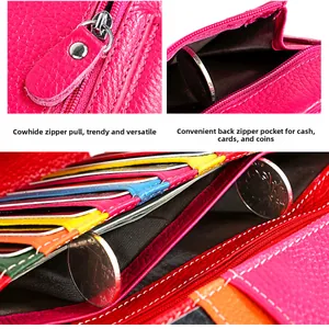 Detail of rose red lychee grain leather wallet showing back zipper pocket and card slots