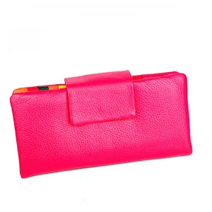 Detail of pink long wallet showing lychee grain leather and colorful inner card slots