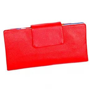 Detail view of a red pebble grain leather long wallet with functional card slots