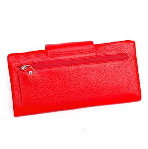 Macro shot of red pebble grain leather wallet featuring a functional back zipper pocket