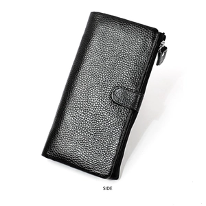 Detail view of the black pebbled leather wallet featuring side zipper and buckle closure