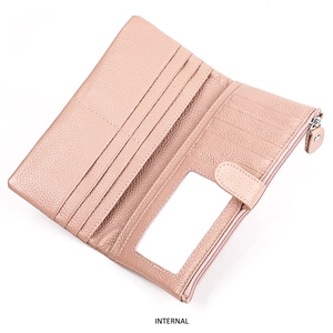 Detail view of pink leather wallet interior with RFID blocking slots and zipper pocket