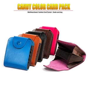 Slim leather card holder featuring multiple slots and secure snap button closure