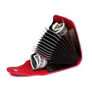 Detail of red lychee leather card holder with accordion slots and silver snap button