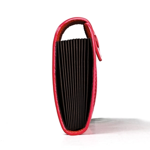 Slim red leather accordion card holder with multi-slot storage and compact design