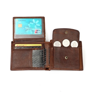 Detail of genuine leather wallet showing card slots and snap button coin pocket