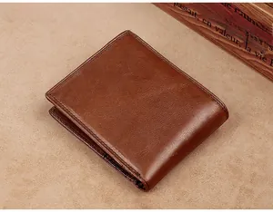 Close-up of premium brown leather bifold wallet with fine stitching and natural texture
