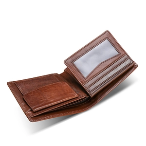 Brown genuine leather bifold wallet with card slots and a coin pocket on white background