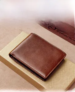 Macro shot of brown genuine leather men's wallet showing premium texture and stitching