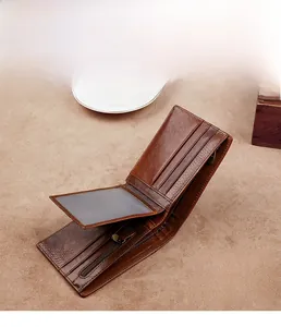 Interior detail of a brown leather wallet showing card slots and zipper coin pocket