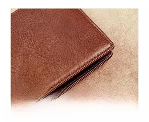 Close-up of precise stitching on premium dark brown leather men's wallet for durability