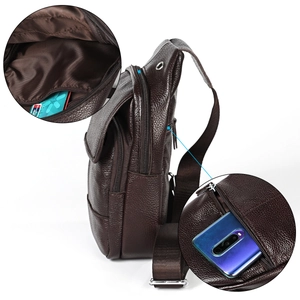 Detail of genuine leather sling bag showing internal card slots and functional pockets