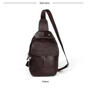 Detail view of dark brown pebbled leather men chest bag with headphone port and zippers