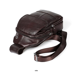 Side view showing three-tier zipper compartments of this dark brown pebbled leather chest bag