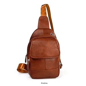 Detailed front view of brown leather sling bag featuring lychee texture and earphone port