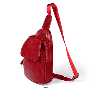 Side view of red lychee pattern genuine leather sling bag with adjustable strap