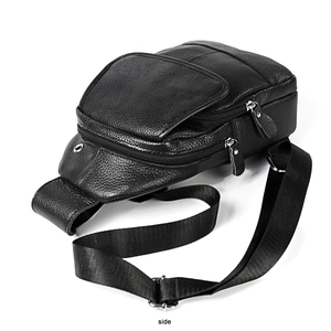 Detailed side view showing lychee textured leather and metal buckle of the men's sling bag
